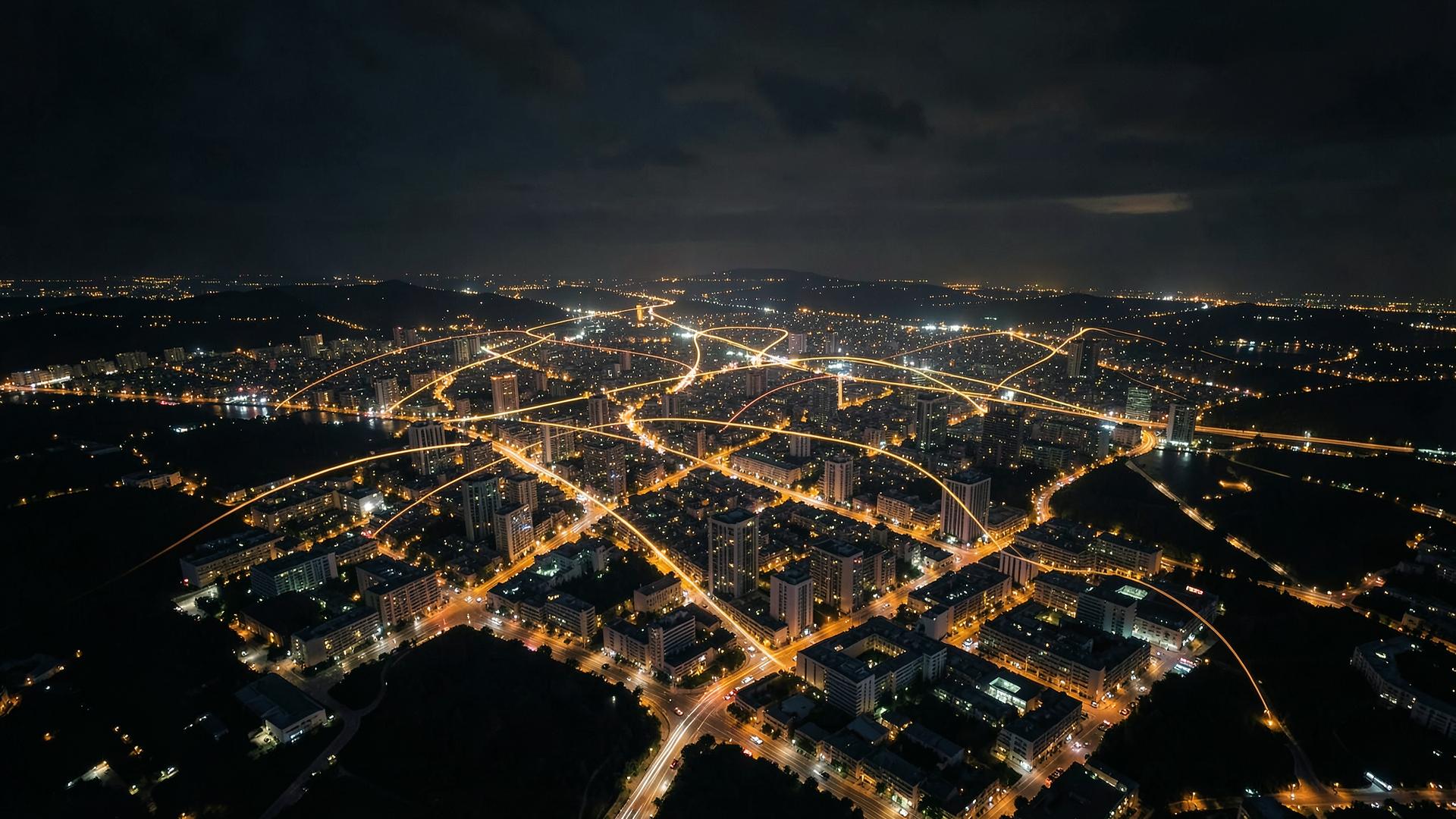Night aerial view of a world city with glowing light trails